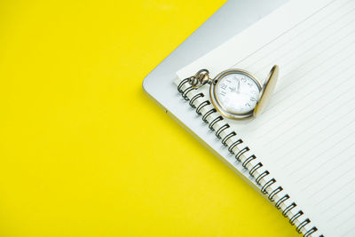 High angle view of clock on table