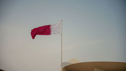 Low angle view of flag against sky