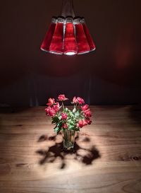 Close-up of red flower vase on table at home