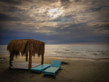 Scenic view of beach against sky during sunset