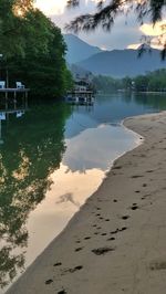 Scenic view of lake against cloudy sky