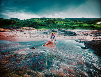 Portrait of young woman in sea