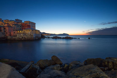 Scenic view of sea against clear sky during sunset