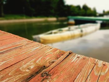 Close-up of wood against lake