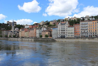 Buildings in city against sky