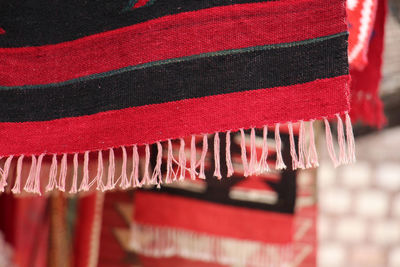 Close-up of red blanket hanging outdoors