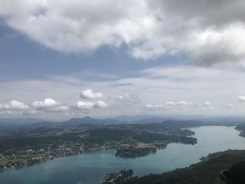 Aerial view of city and mountains against sky