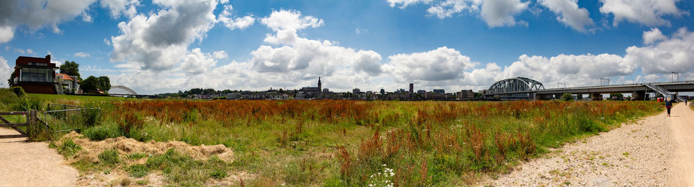 Panoramic view of field against sky