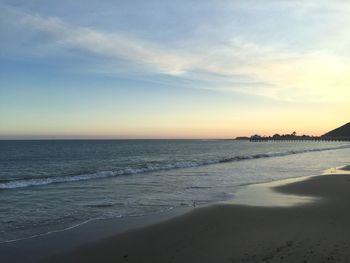 Scenic view of beach at sunset