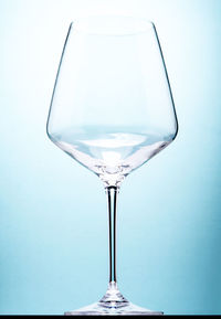 Close-up of wineglass against white background