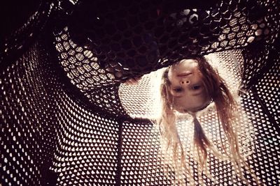 Close-up of girl in cage