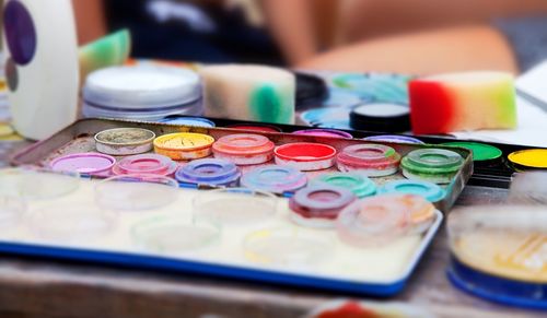 Close-up of multi colored paint on table