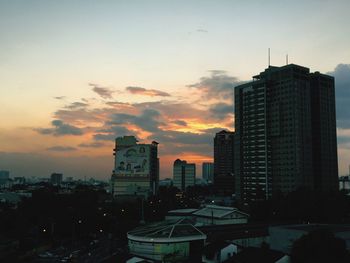 Cityscape against sky during sunset