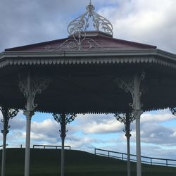 Low angle view of built structure against cloudy sky