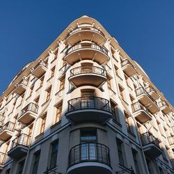 Low angle view of building against blue sky