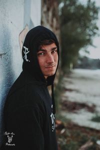 Portrait of young man standing outdoors