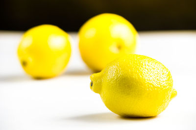 Close-up of lemon slice over white background