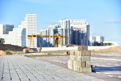 Process of installing paving bricks at construction site. laying paving slabs and borders 