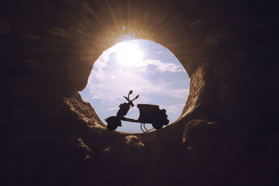 Low angle view of silhouette man against sky