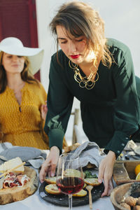 Woman holding plate with food