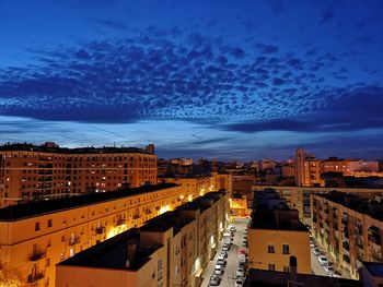 High angle view of buildings in city at night