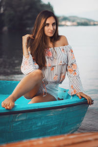 Portrait of young woman in swimming pool