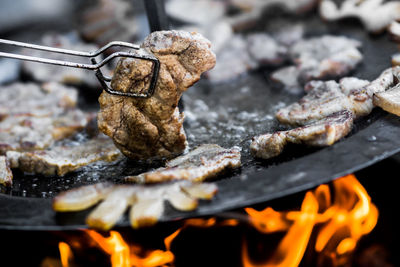 Close-up of meat on barbecue grill