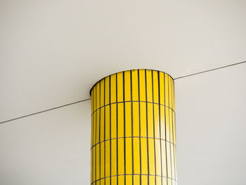 Low angle view of yellow pillar