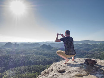 Full length of man on mountain against sky