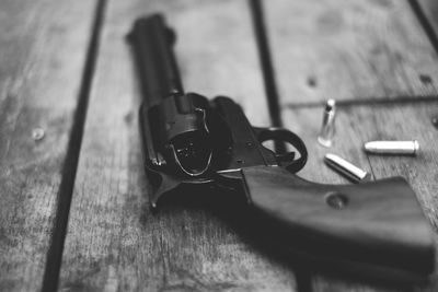 Close-up of handgun with bullets