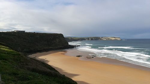 Scenic view of beach against sky