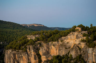 Scenic view of rocky mountains against clear sky