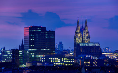 Illuminated buildings in city at night