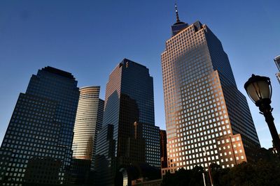 Low angle view of skyscrapers against clear sky