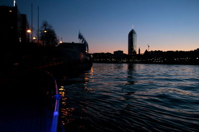 View of city lit up at waterfront
