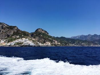 Scenic view of sea against clear blue sky