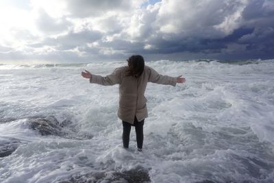 Scenic view of sea against cloudy sky