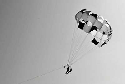 Low angle view of kite flying against sky