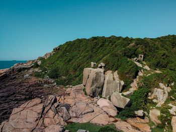 Scenic view of sea against clear blue sky