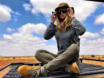 Portrait of woman on top of truck