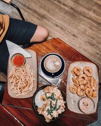 High angle view of man having food on table