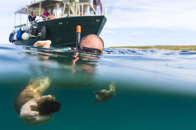 Man scuba diving in sea