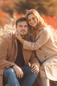 Portrait of couple sitting outdoors