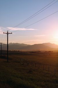 Scenic view of field against sky during sunset