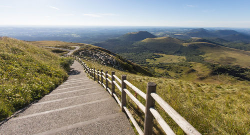 Path at the top of puy-de-dôme with a view of the volcanic massif of the chaîne des puys