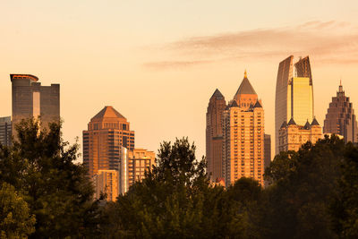 Buildings against sky during sunset