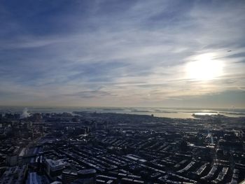 High angle view of city against cloudy sky