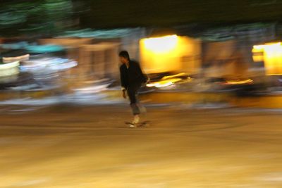 Man running on road at night