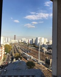 High angle view of street amidst buildings against sky