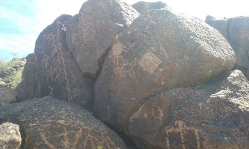 Close-up of stone wall against sky